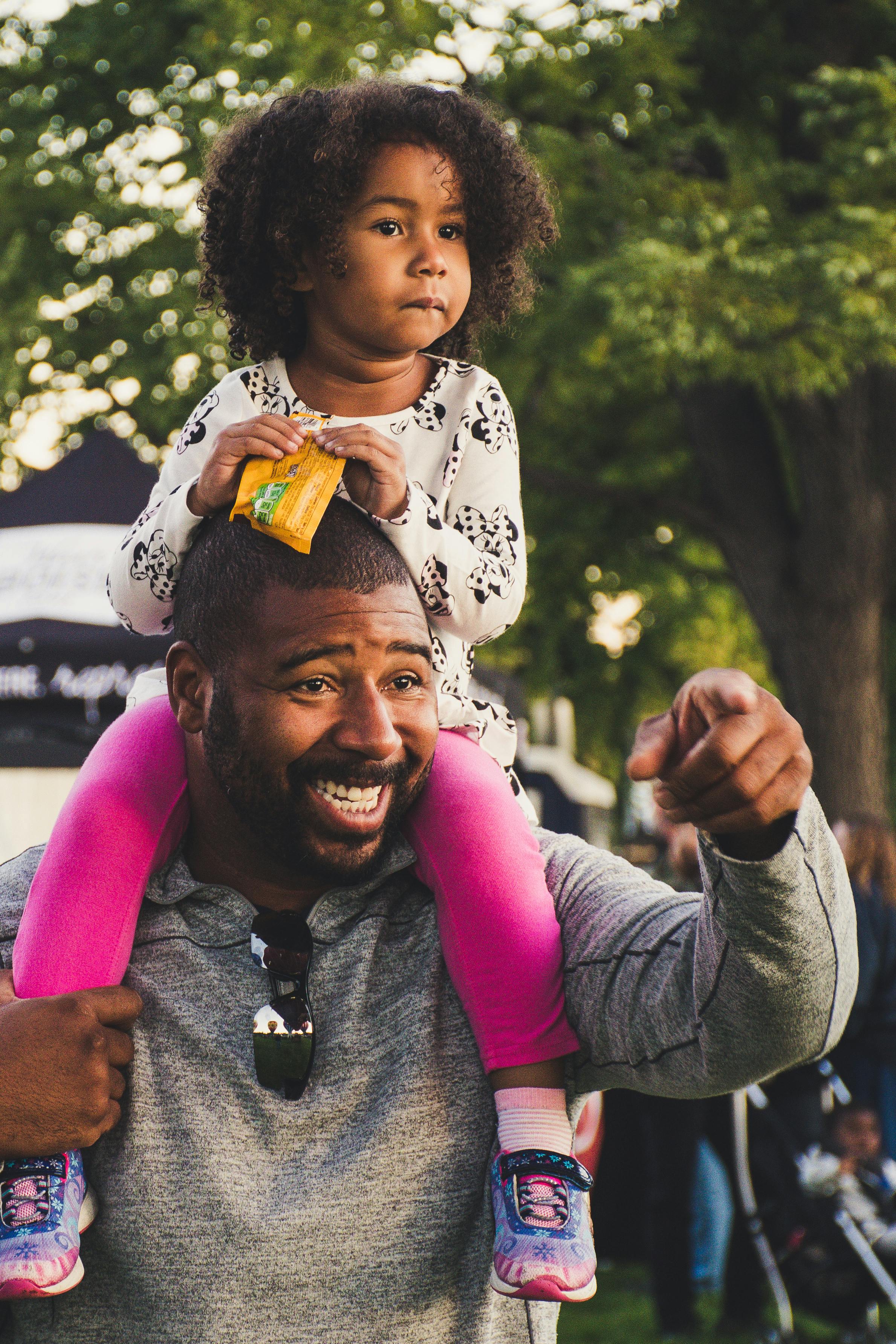 Happy father showcases parental involvement